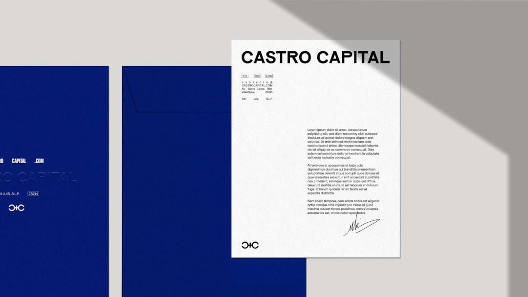 A blue book with a black and white logo on it