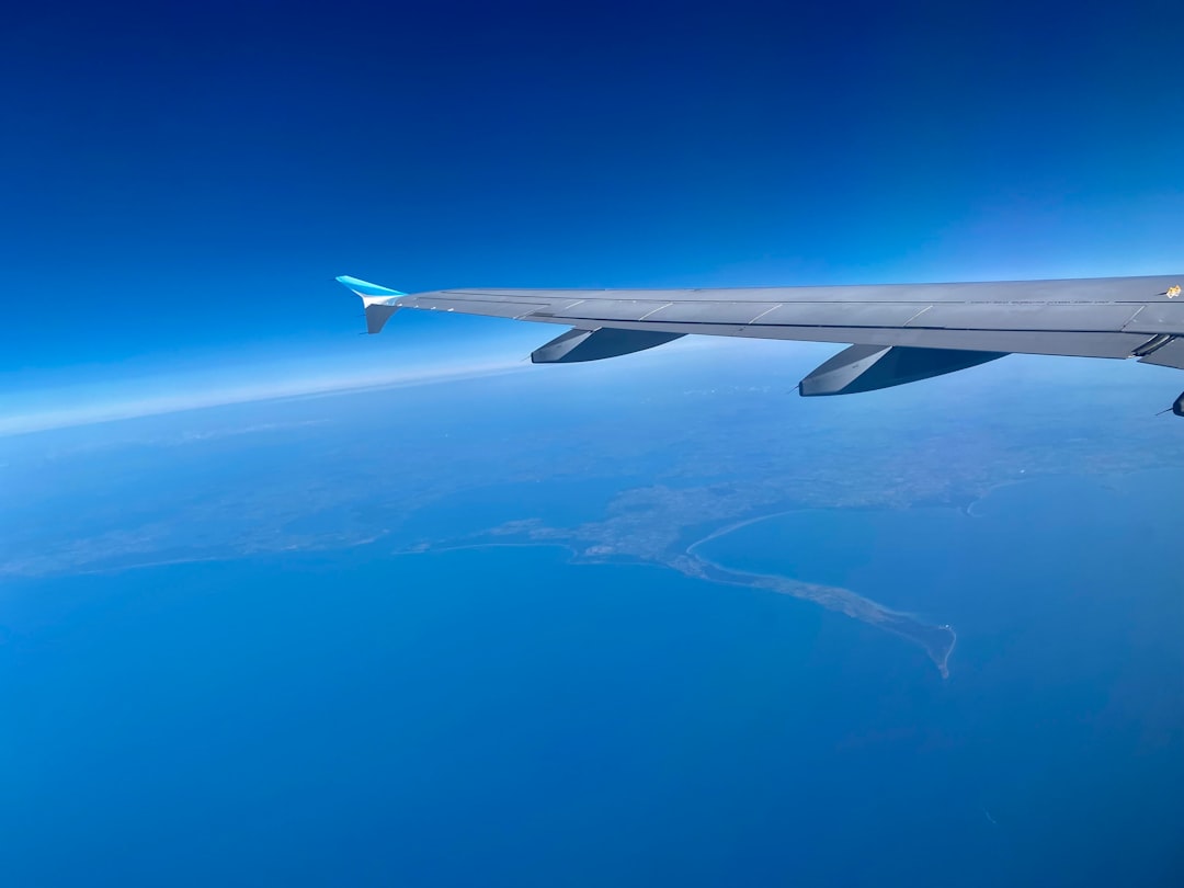 An airplane flying over the ocean